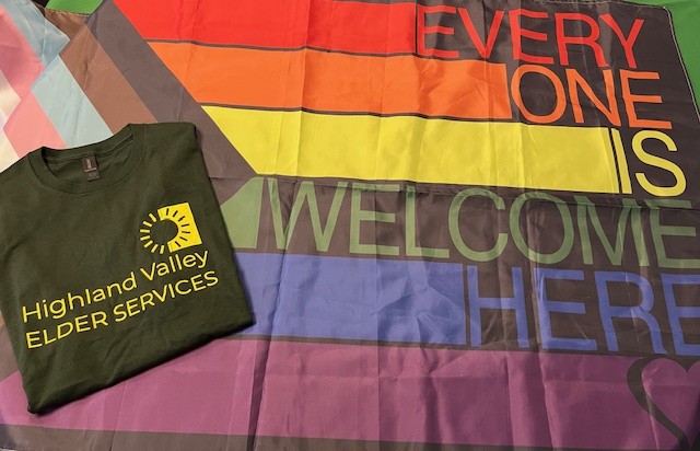 This is a Pride parade flag and Highland Valley Elder Services' t-shirt. We are taking part in the Hampshire Pride parade on May 2, 2026.